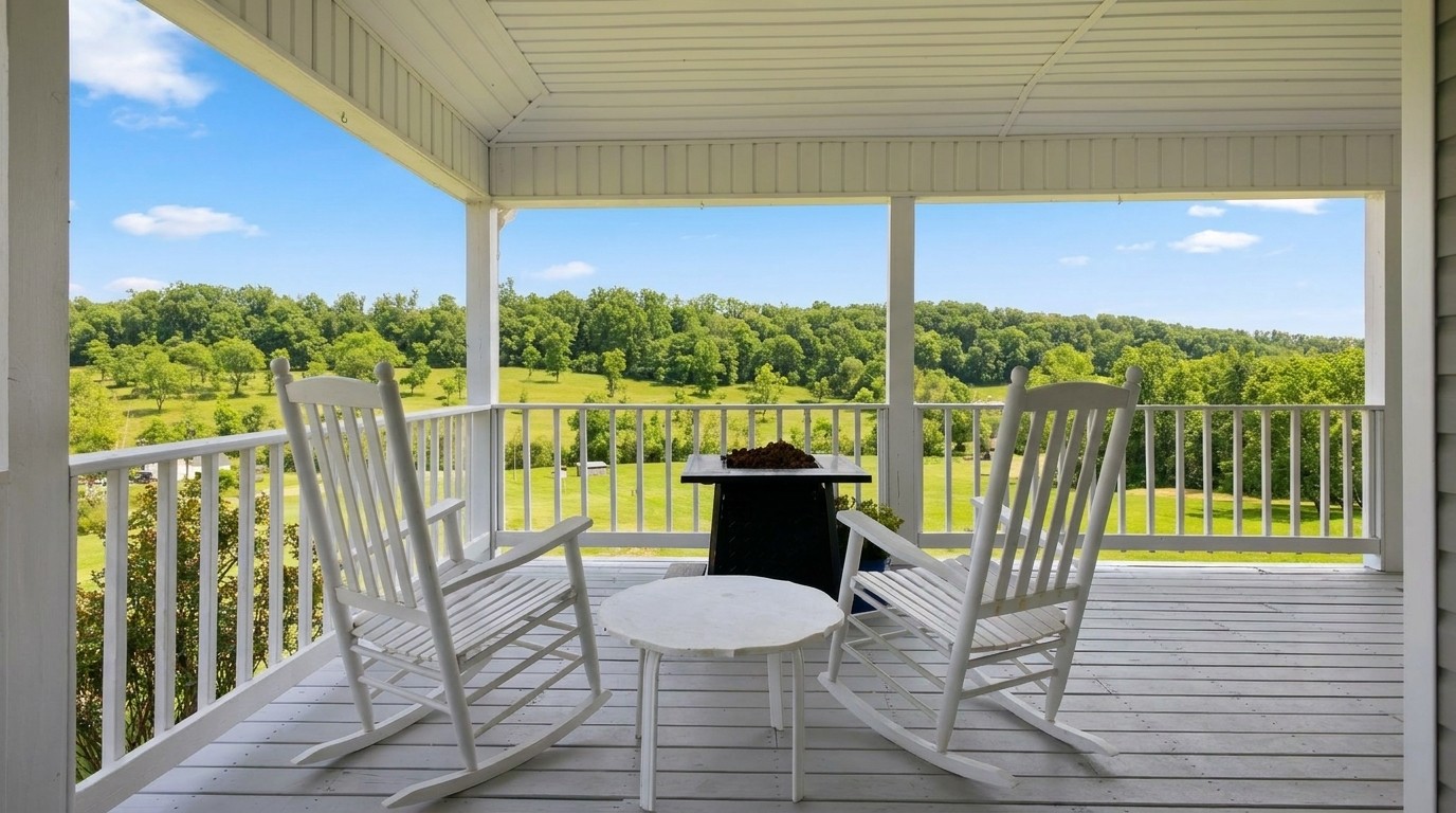 Rocking chairs framing Keg Springs Valley views from covered deck