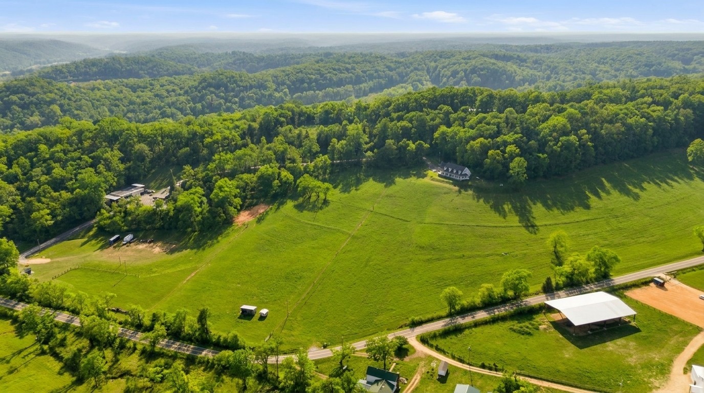 High aerial showing full 40-acre property and road frontage — Lewis County TN